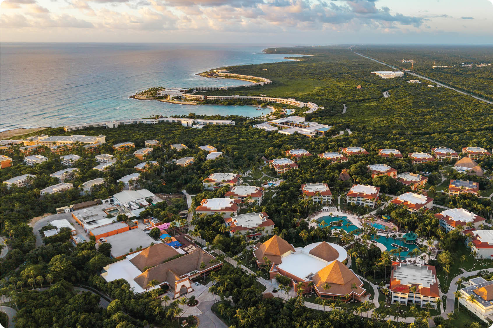 A large group of buildings, including hotels, are situated near the beach. AI generated content