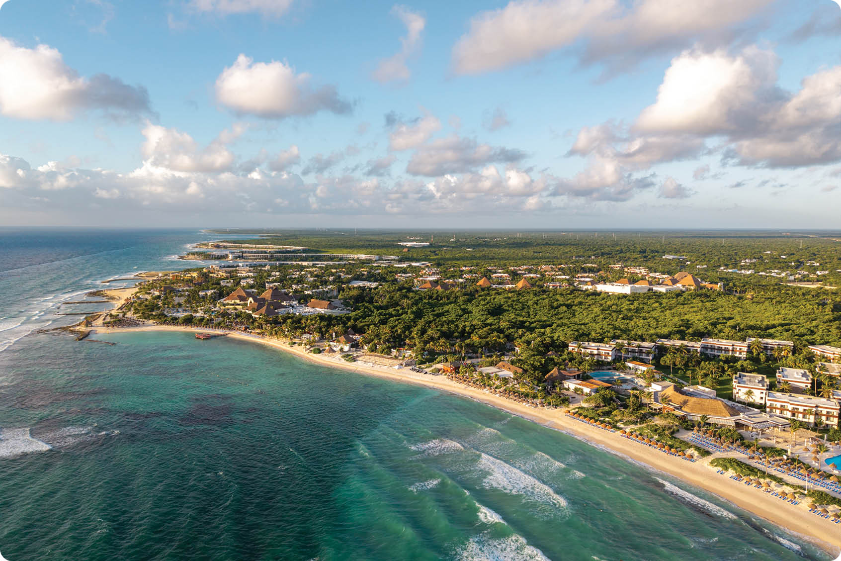 A beach scene with a city in the background. AI generated content